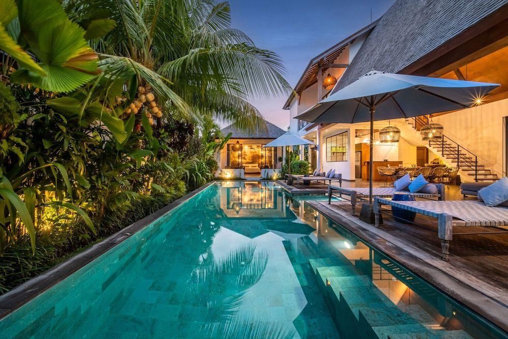 Private tropical villa with a pool surrounded by lush greenery