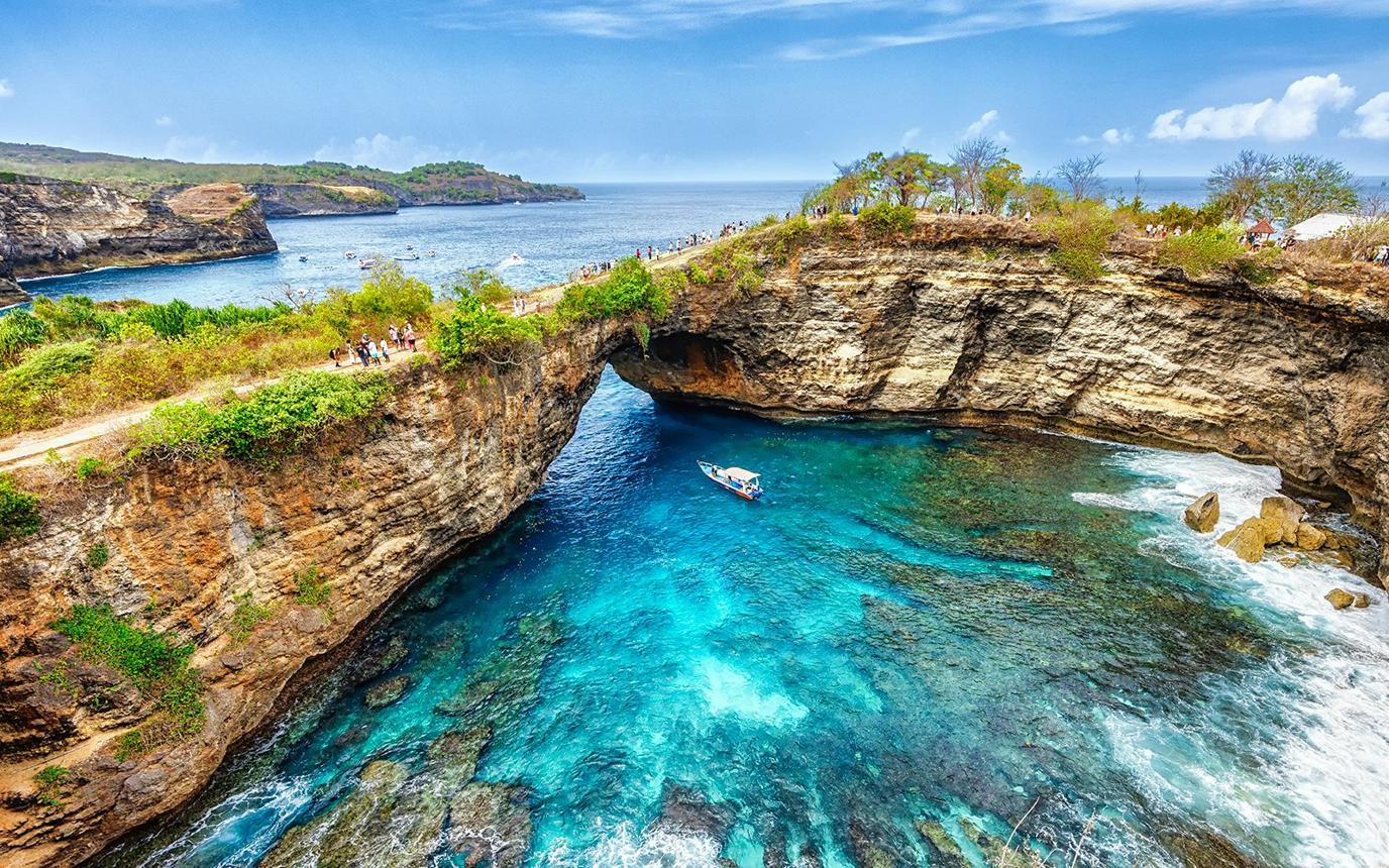 Turquoise water along a rugged tropical island coast