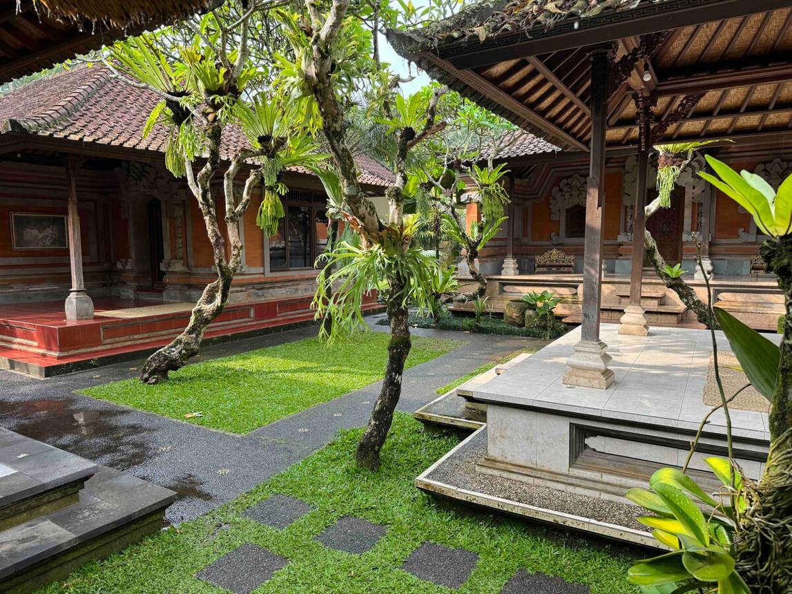 Traditional Balinese villa courtyard and tropical garden